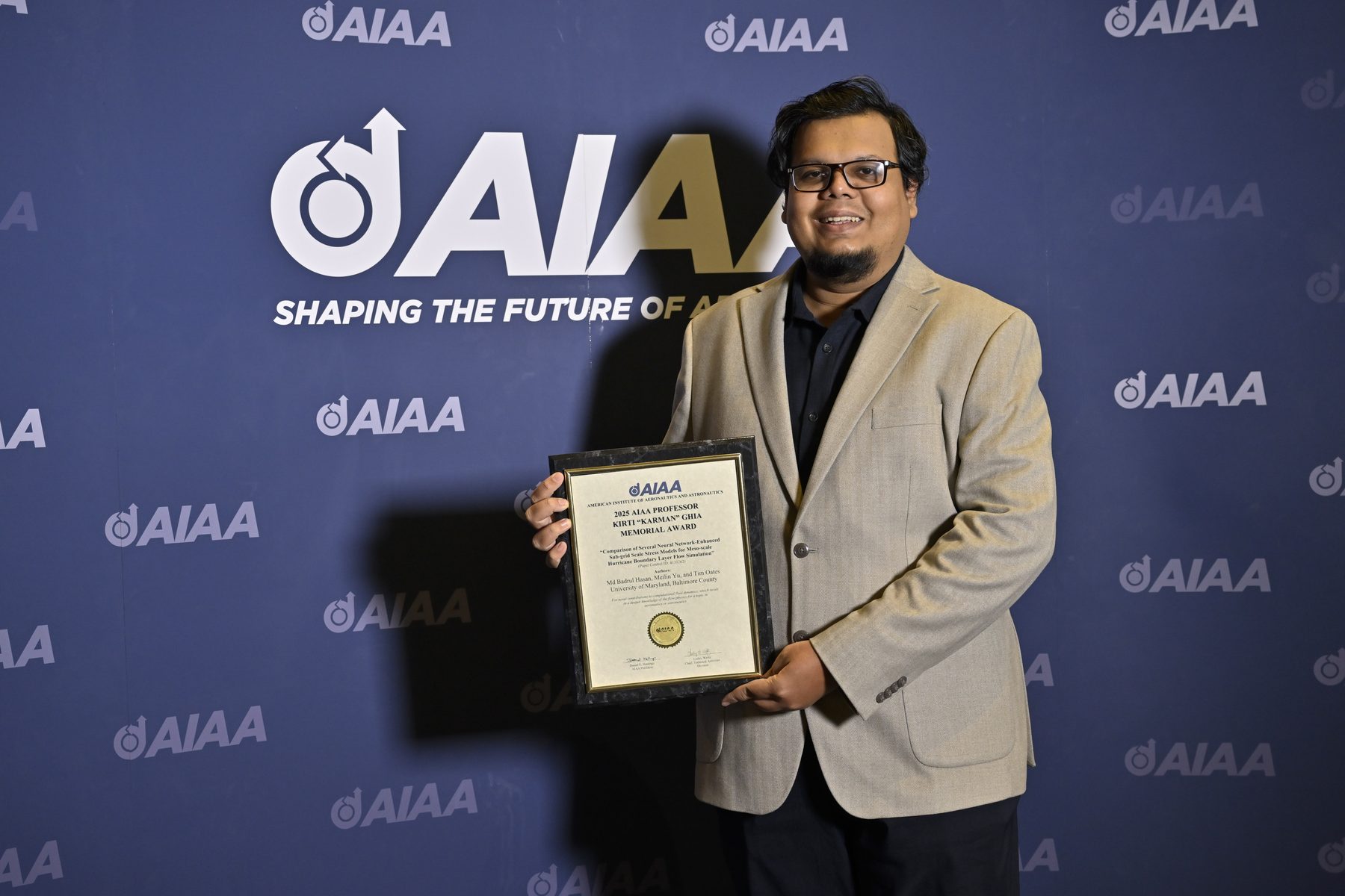 Holding the AIAA award plaque at SciTech 2025