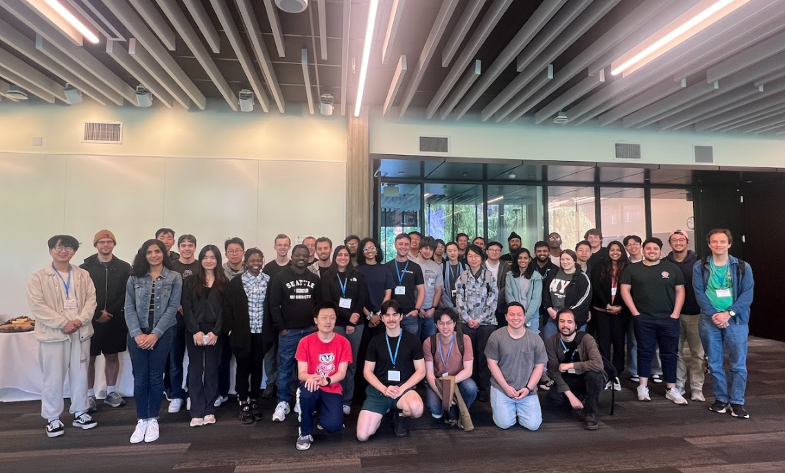Indoor group photo of participants and mentors