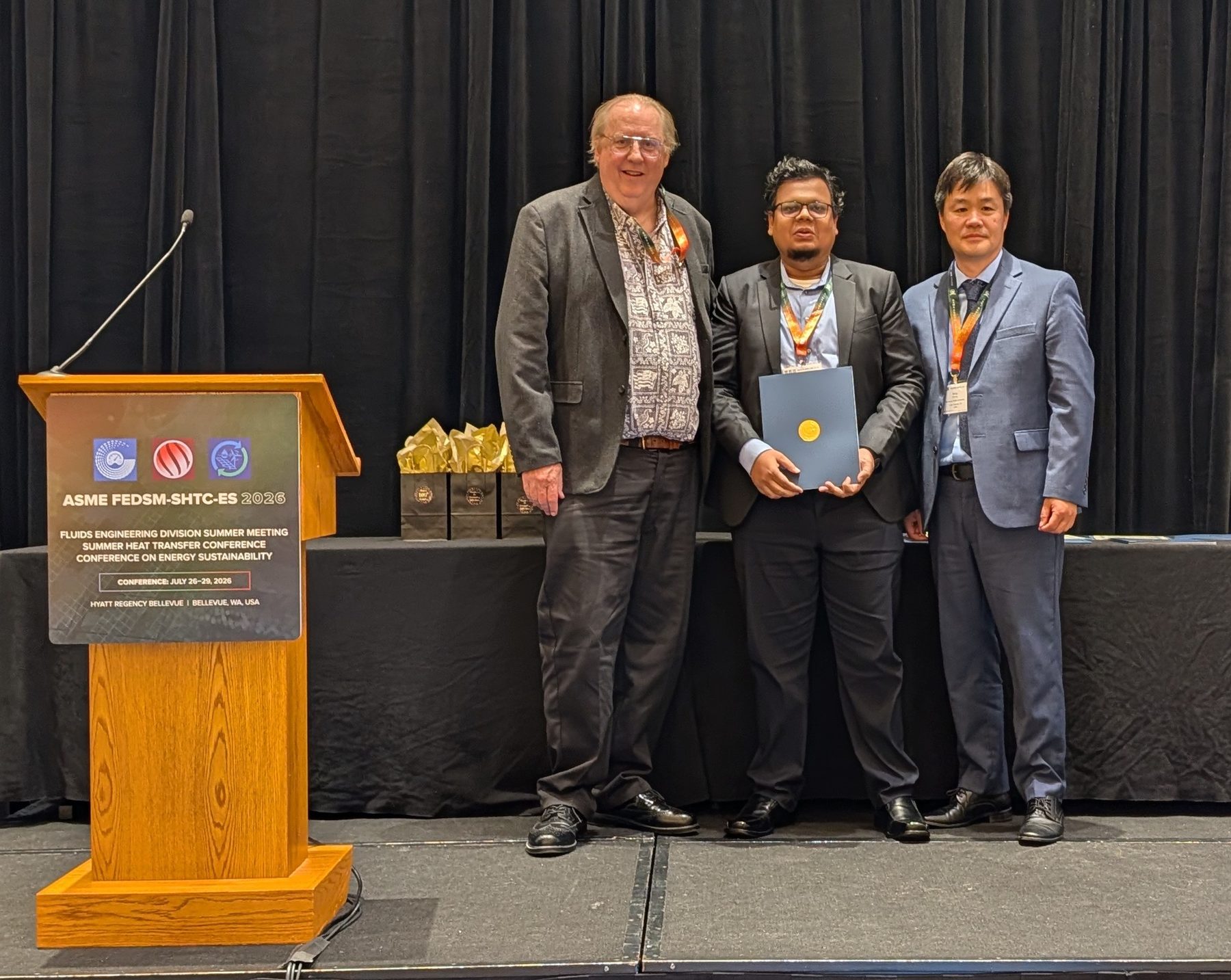 Receiving the ASME Fluids Engineering Division Ghia Scholar award at FEDSM 2026